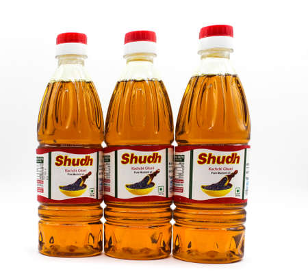 Noida , Utter pardesh , India - october 18 2021 , Musterd oil bottles , A picture of musterd oil bottles on white background with selective focus in noida october 18 2021のeditorial素材