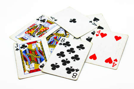 Playing cards on white background with selective focus