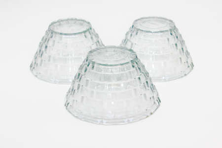 Glass bowls on white background with selective focusの写真素材