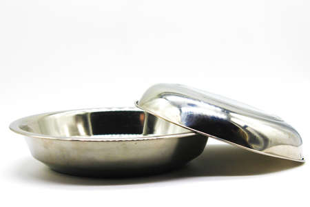 Stainless Steel plates on white background with selective focusの写真素材