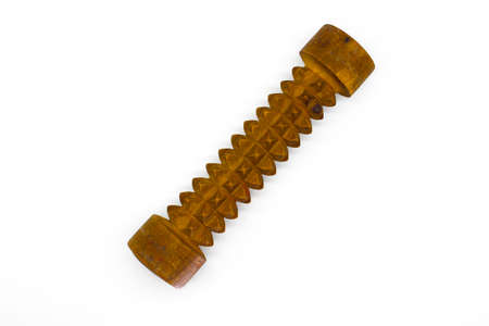 A picture of wooden massage roller on white background with selective focusの写真素材