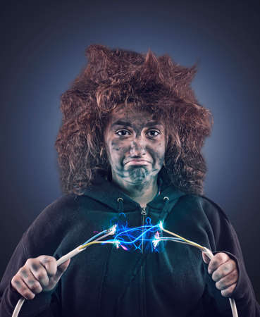 Young girl with messy hair being shocked by electric cable.