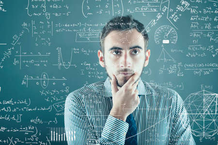 The young businessman tries to solve problemsの写真素材