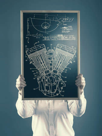 The young girl shows a diagram drawn on a blackboard propellerの写真素材