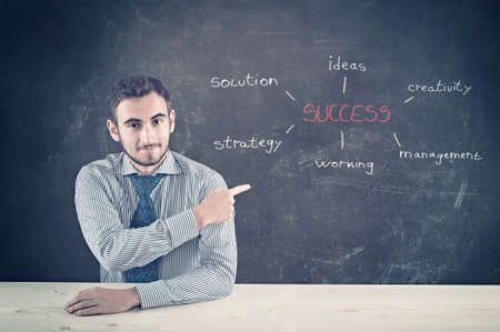 Teenager and blackboard with concept of succeessの写真素材
