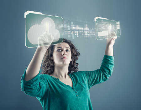 Young girl transfering database from a cloud folder to a circuit folder