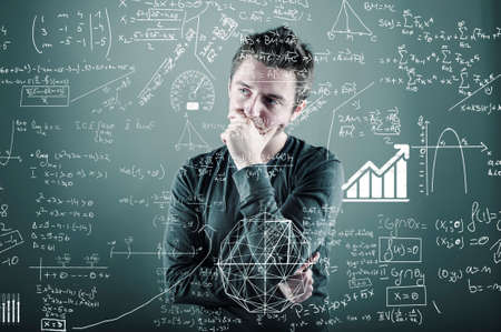 Teenager is thinking of a solution to a math formulaの写真素材