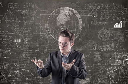 Confused businessman explain math formulas on blackboard