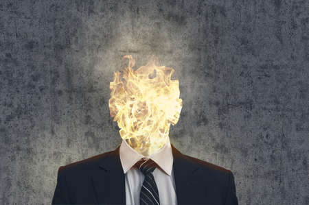 Business man with a flame head.