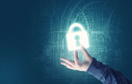 Handheld and a bright padlock image with a sketch backgroundの写真素材