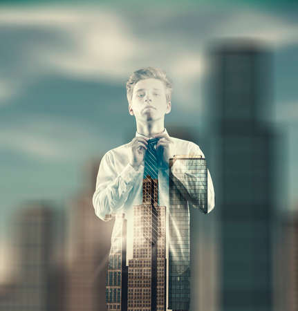 Double exposure of a bussiness man linking his tie on a city background.