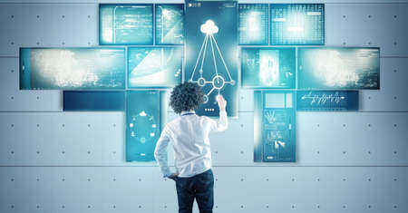 The young businessman works with multi touch screens, modern technology concept