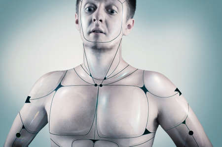 Portrait of a cyborg male in a blue background.