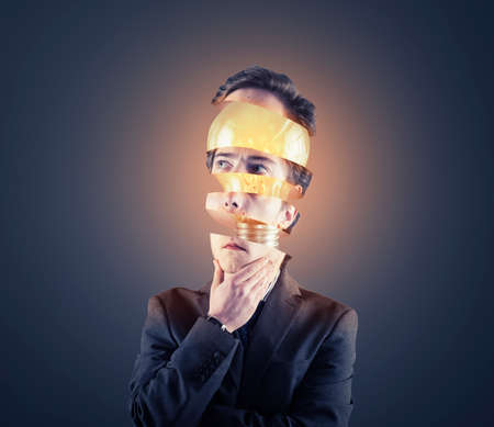 Thoughtful businessman with his head sliced have an lightbulb inside.の写真素材