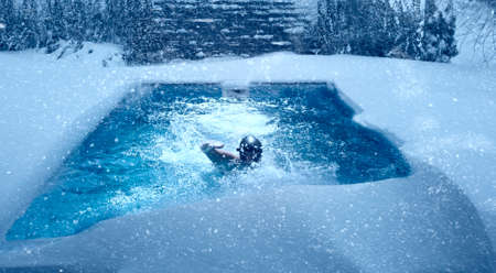 Swimming in pool during winter.の写真素材