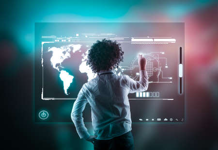 Man using high tech screen on a abstract background with bokeh lights.の写真素材