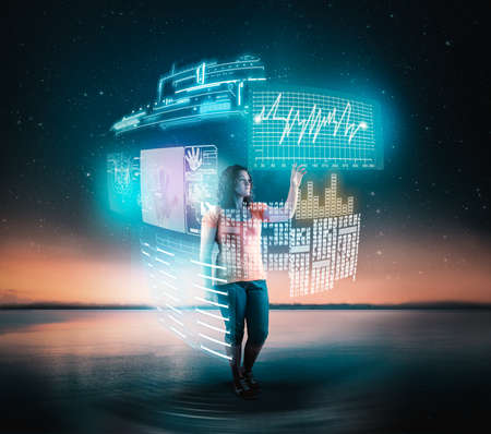 Young woman using hologram of a digital screens outdoor.の写真素材