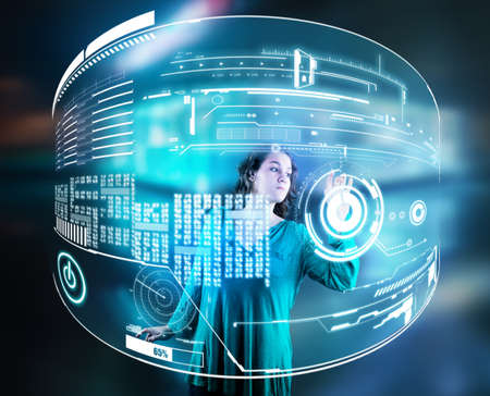 Woman working on hologram of a digital screen, displayed with data.