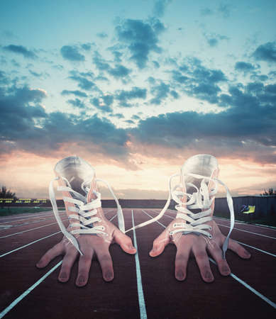 Pair of gloves with laces look like real hands on the running trackの写真素材