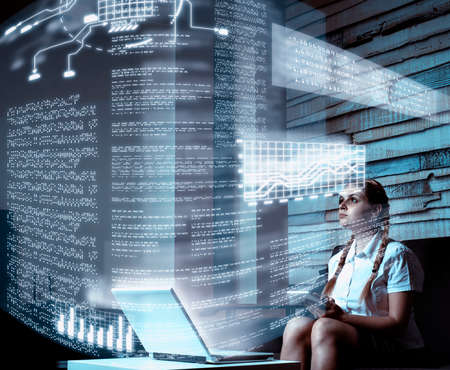 Young woman using tablet and infograph screen at home.Futuristic user interface.