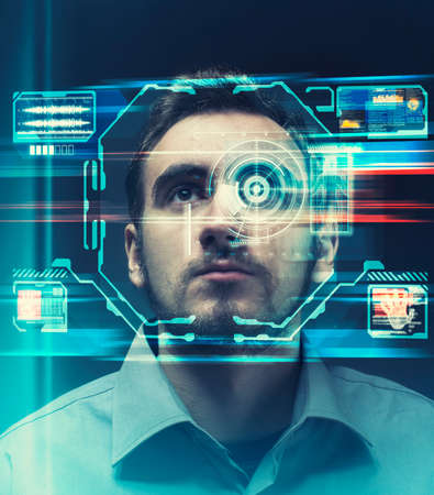 Man using face recognition system. Personal data information being analyzed and verified.の写真素材