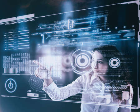 Woman working on digital touch screen with data and informations.Futuristic user interface.