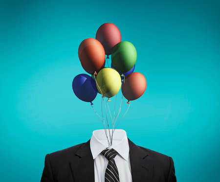 Business suit with colorful balloons in place of head .The concept of positive and calm mind....