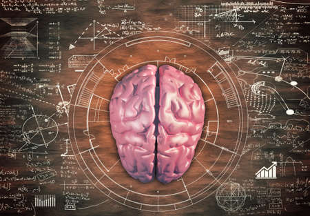 Brain against a wooden table full of math formulas.