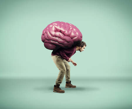 Man carries a big human brain.の写真素材