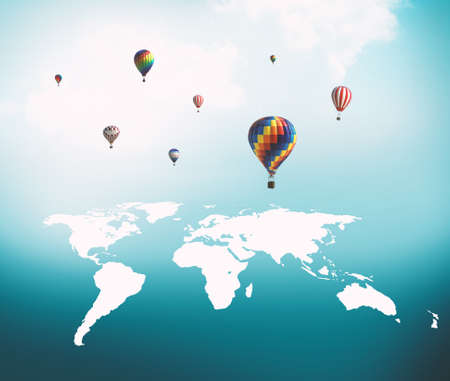 Hot air balloons flying over world map.