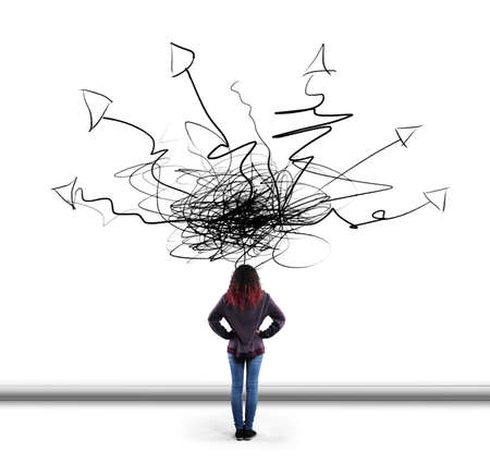 Woman in front of drawn wall with arrows leading to different directions. The concept of variety of...