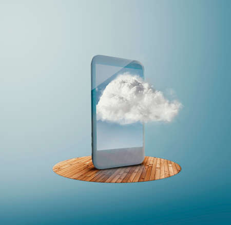 Smartphone on wood with a cloud out of screen.