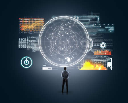 Businessman looking at a circle of futustic user interface , data and information.