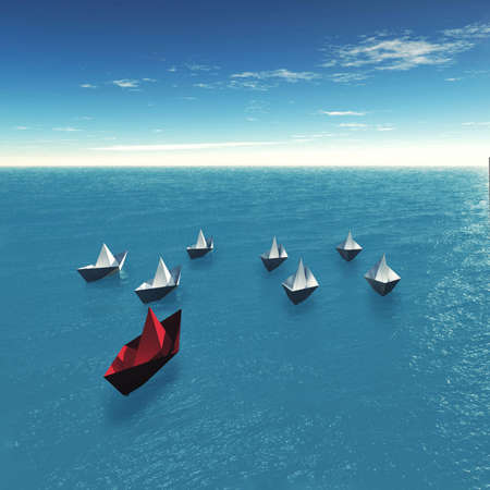 Group paper boats on the ocean . Red paper boat in front of multiple boats . Leadership concept .の写真素材