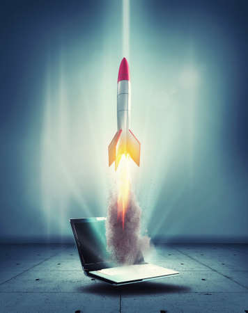 Startup concept with rocket flying out of laptop. Start online business . This is a 3d render illustration.の写真素材