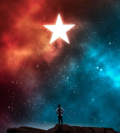 Young man looking at a star during night on a colorful nebula .