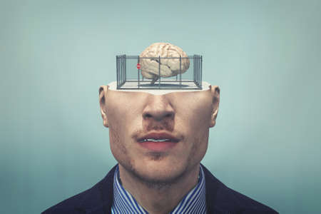 Human brain in a cage . Closed mind concept . Limited thinking and anxiety . Mental illness . This is a 3d render illustration .の写真素材