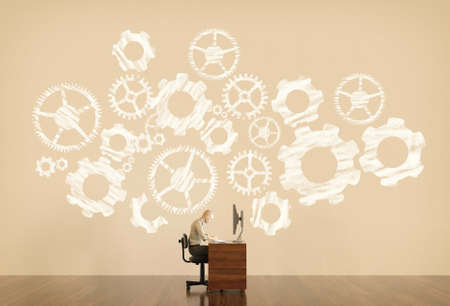 Man works on computer with cogwheels drawn on background . Freelancing and problem solving concept ....