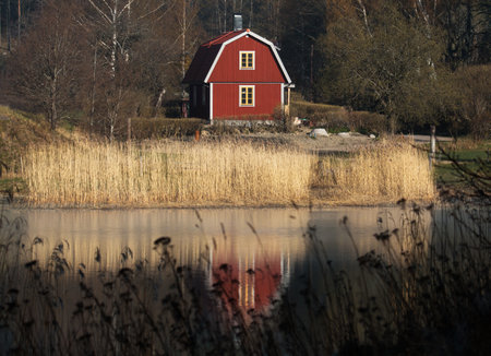 Red cottage by the lakeのeditorial素材