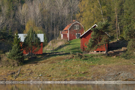 Red cottages near waterのeditorial素材