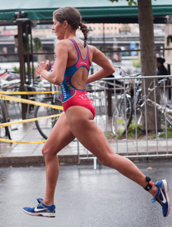 STOCKHOLM - AUG, 23:  World Triathlon  event Aug 23, 2014. woman running in Old town, Stockholm, Sweden. Carolina Routier, ESP.のeditorial素材