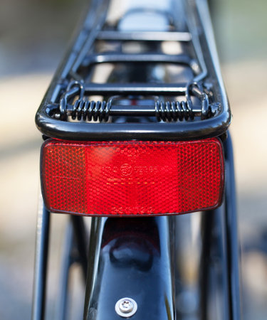 HOLO, SWEDEN, March 20. 2015. A red reflector mounted on the bike luggage carriers.のeditorial素材