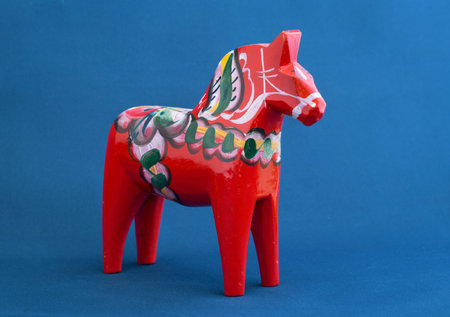 STOCKHOLM, SWEDEN, February 22, 2015. A typical Swedish Dala horse against blue background.のeditorial素材