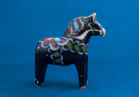 STOCKHOLM SWEDEN, FEBRUARY 22, 2015. An old worn black wooden horse from Dalarna Sweden.のeditorial素材