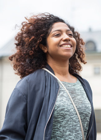 STOCKHOLM, SWEDEN - MAY 31, 2015. Peace and Love Parade. Street party in Stockholm, girl sitting on a man's shoulders.のeditorial素材