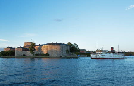 STOCKHOLM-AUG-13-2015. Passenger boat in the Stockholm archipelago. Vaxholm boat Stockholm port to pick up and drop passengers. in the background is the Vaxholm Fortressのeditorial素材