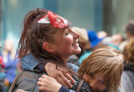STOCKHOLM, SWEDEN - MAY 31, 2015. Peace and Love Parade. Street party in Stockholm, Children and adult hugging.のeditorial素材