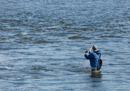 Fishermen in downtown Stockholm below the Royal Palace.のeditorial素材