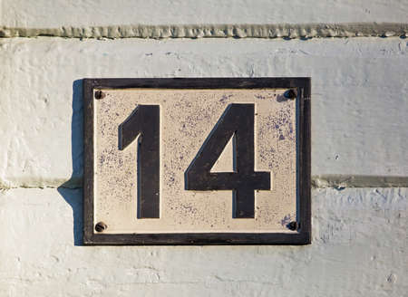 Numeral 14 in a housing wallの写真素材