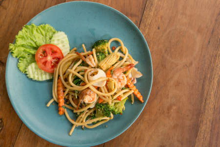Spaghetti with spicy seafood asian style - street foodの写真素材